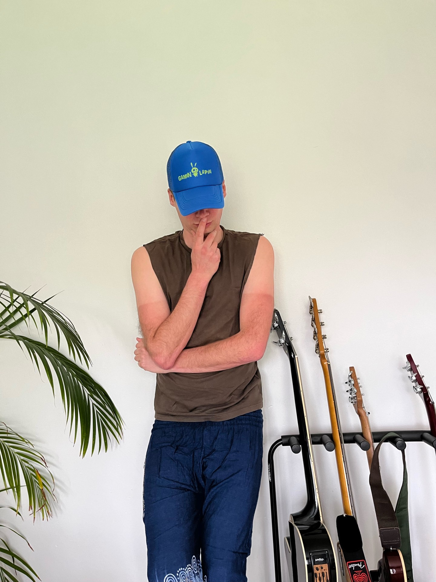 Blue trucker cap with green logo